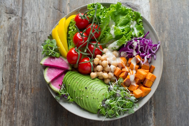 Nutritional meal with tomato, avocado, lettuce and squash.